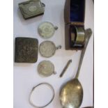 A quantity of small silver items to include a cased napkin ring, a 1922 silver dollar, mounted