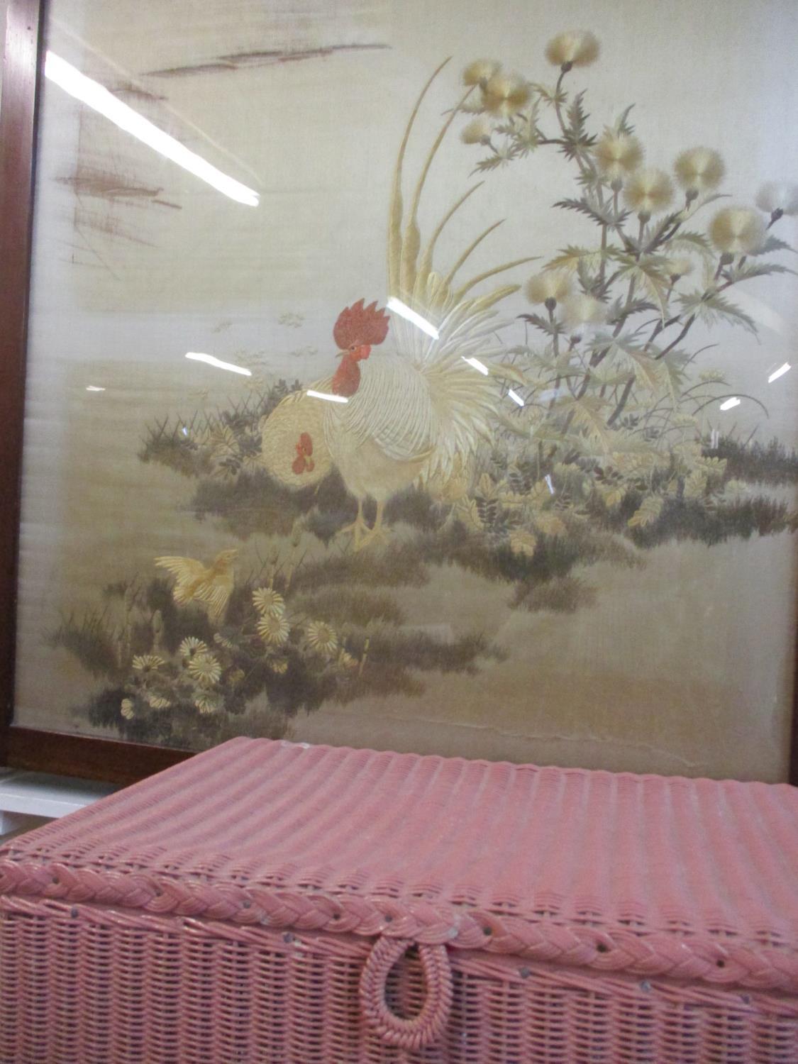 A Pink Lloyd Loom linen basket together with a silk embroidered picture of a cockerel and two