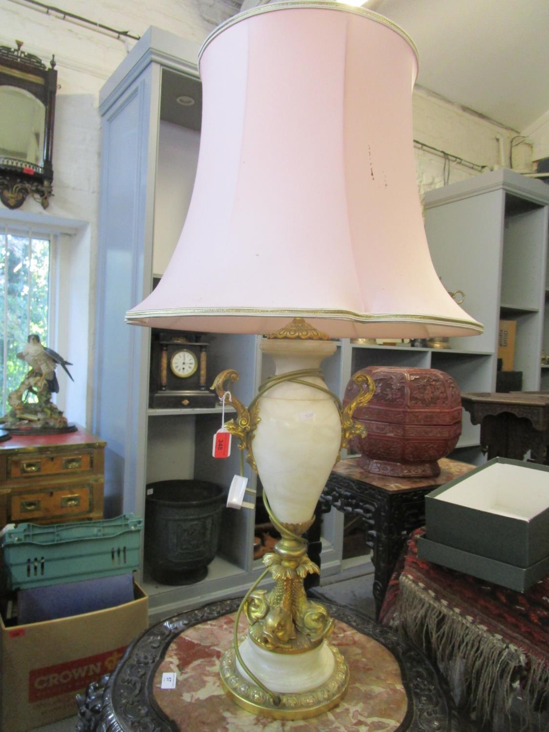 A white onyx and brass table lamp of vase design with a shade