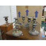 A pair of early 20th century silver plated candelabra each with three sconces