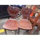 A pair of Victorian shield back hall chairs