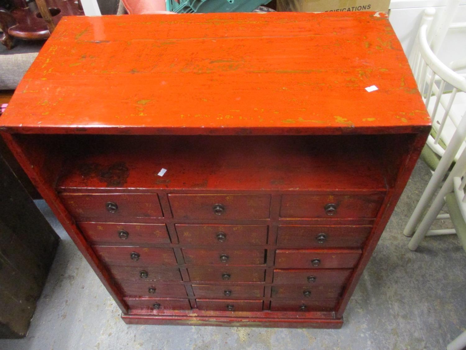 A Chinese lacquered and painted chest with a shelf over eighteen drawers on a plinth - Image 2 of 2