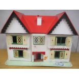A vintage painted dolls house