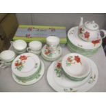 A Duchess Poppies pattern dinner and tea set, along with an At Home, Ashley Thomas teaset, boxed