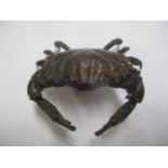 A reproduction Japanese bronze ornament of a crab, 4cm h x 7.5cm w