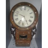 A Victorian walnut cased drop dial wall clock having mother of pearl and string inlaid banding,