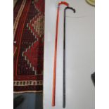 Two coloured glass walking sticks