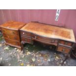 A 1930's walnut bedroom furniture to include a wardrobe, dressing table and a small three drawer