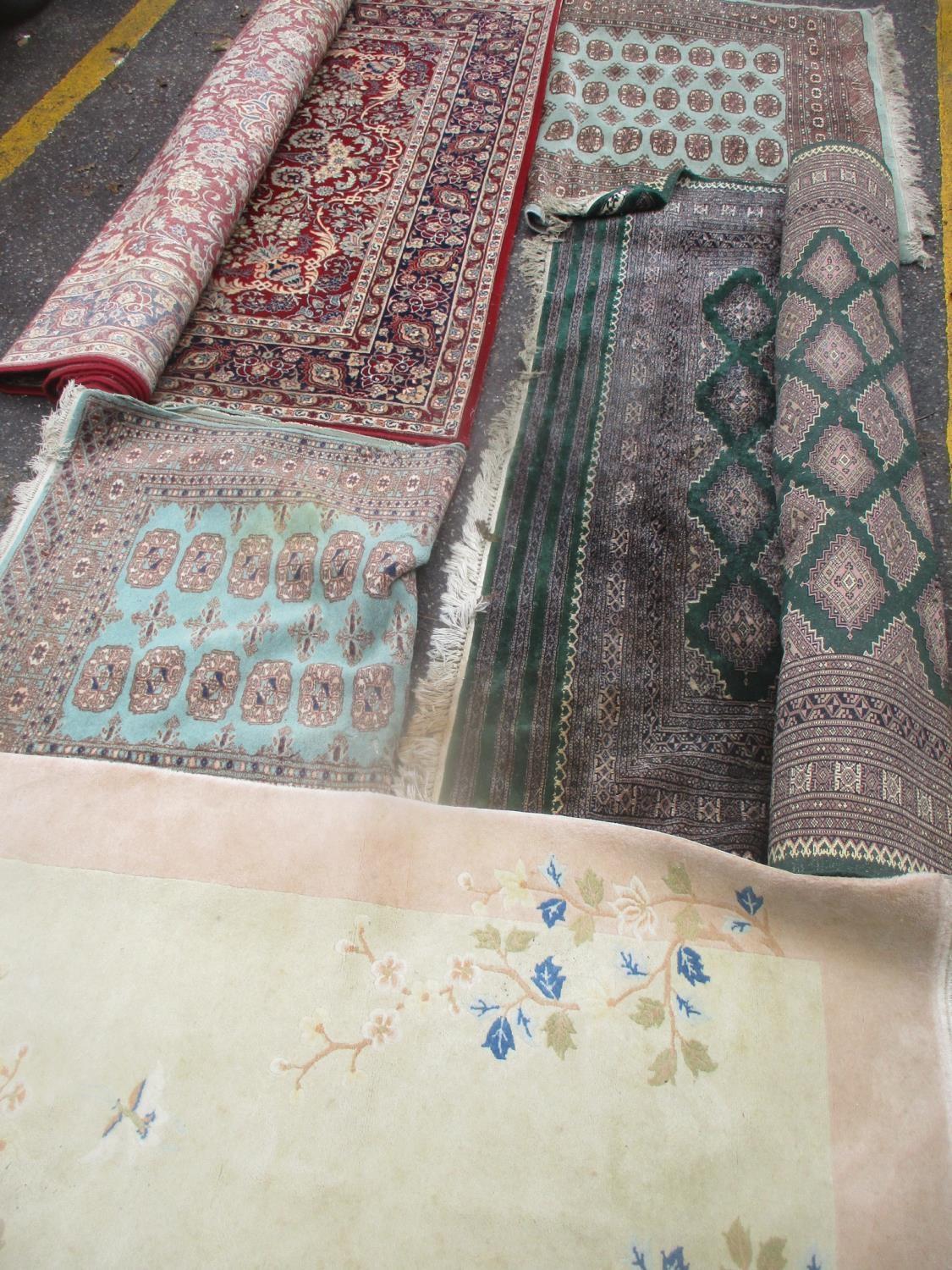 Mixed rugs to include a Pakistan green ground rug having multiguard borders and geometric design