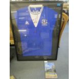 A 2010 signed Everton football shirt carrying eighteen signatures, framed and glazed, along with a