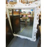 A white painted late 19th century/20th century framed wall mirror 98cm x 85cm