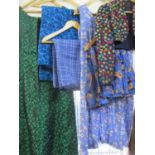 A collection of mid 20th century clothing to include an embroidered bolero jacket, a Carnege
