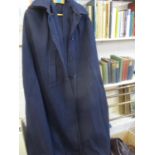 A 1950s-60s full length school cape in navy with a burgundy hood, together with various straw