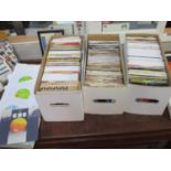 Four boxes of 1970s, 1980s and 1990s singles, approximately 500