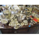 Silver sugar tongs and a large quantity of silver plate and metal ware to include a candelabra,