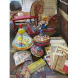 Vintage toys to include two wooden sit on toys, three spinning tops, a mechanical bear, a small