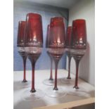 A set of six Watford red cut Champagne glasses etched John Rocha Waterford