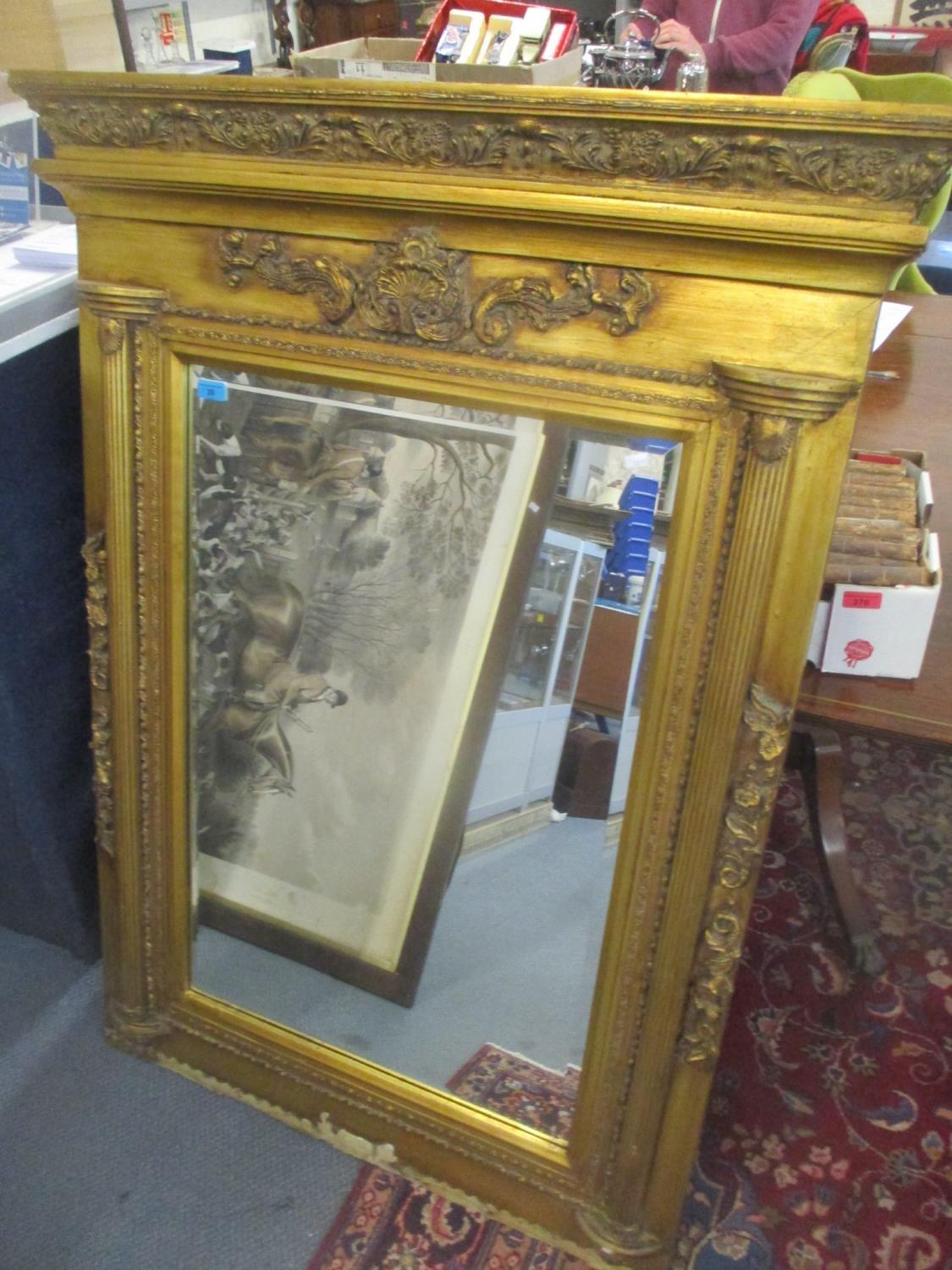 A modern gilt framed mirror with moulded ornament