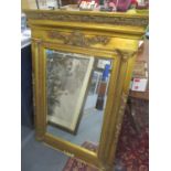 A modern gilt framed mirror with moulded ornament