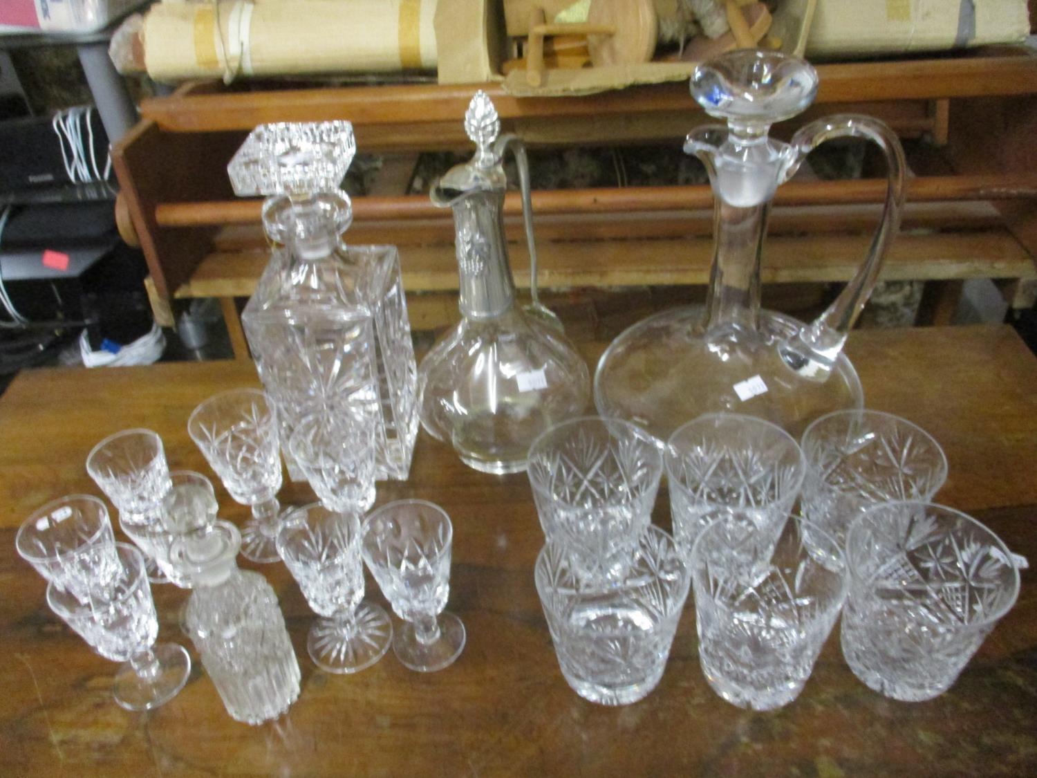 Glassware to include decanters, a claret jug and glasses