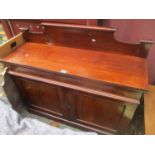 A Victorian mahogany chiffonier with raised back, central drawer cupboards below on a plinth base,