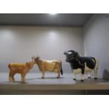 A Beswick Friesian bull, marked Coddington Hilt bar, a Beswick bullock and a Beswick and a Beswick