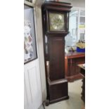 An 18th century and later oak Longcase clock with a later brass and silvered dial with a non-