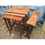 An Edwardian mahogany nest of three tables together with an Edwardian Sutherland table