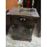 A modern chinoiserie black lacquered cabinet with a drawer and a door, 71h x 46cmw