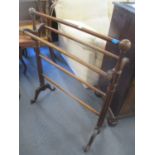 A Victorian walnut towel rail having fluted supports, 84h x 69w