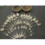 A quantity of silver plated cutlery and flatware together with a pair of silver plated wine coasters