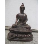 A reproduction cast metal figure of a Buddha, 14.5cm h x 10cm w