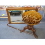A Victorian walnut height adjustable piano stool and a contemporary walnut overmantle mirror,