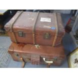 Two vintage leather twin handled suitcases