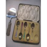 A Georg Jensen silver handled cheese plane, together with five silver teaspoons with enamelled