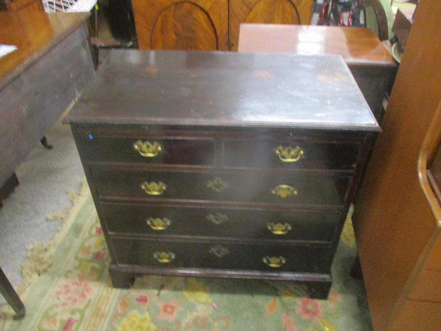A George III mahogany dressing chest with a slide, two short and two long drawers on bracket feet