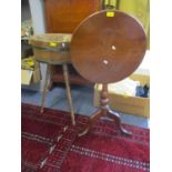 A 1920s oak brass banded jardiniere on three turned legs and a small elm stool and a Georgian tripod