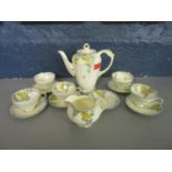 A Paragon floral patterned coffee set A/F Condition: slight hairline cracks and a chip, all age