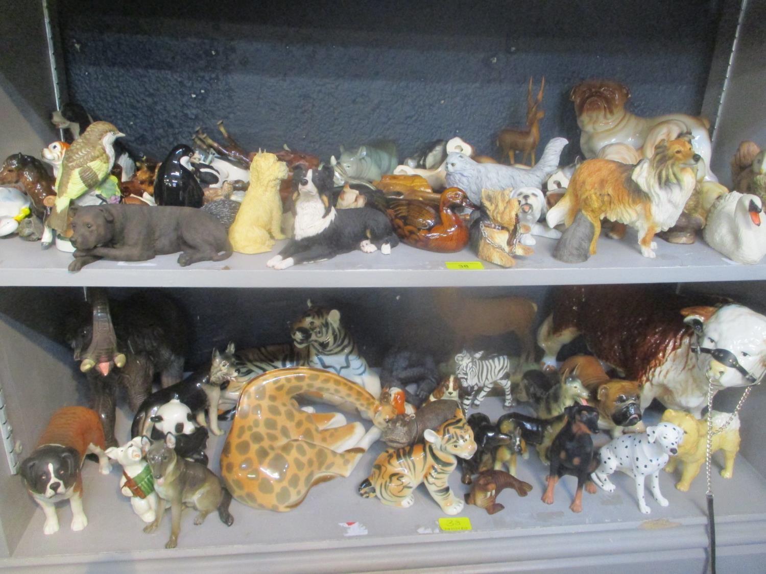 Mixed animal ornaments to include a USSR tiger, giraffe, Beswick dogs and others