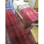 A Persian red ground runner, 356 x 78cm w, together with four small rugs