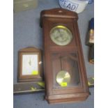 An early 20th century oak wall hanging 8 day clock, together with a quartz clock