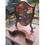 A late 19th/early 20th century mahogany shield shaped dressing table mirror with two inset