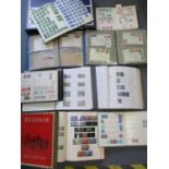 Four partially filled British stamp albums, three stock books and two albums of franked envelopes