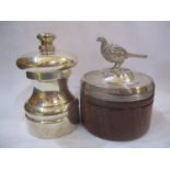 A silver Peter Piper pepper grinder and a silver lidded wooden pot with a pheasant finial