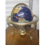 A table top globe inset with semi precious stones, 36.5 h x 25.5cm w