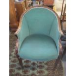 An early 20th century French walnut tub chair