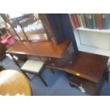 A Stag mahogany dressing table, together with a stool, chest of drawers, a bedside table and a