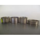 Four mixed silver napkin rings, 73g