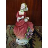 A Royal Crown Staffordshire figure of a young lady with flowers on her dress Location: 9:1
