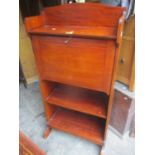 An Edwardian mahogany students bureau having fall flap above two open shelves, 123h x 61cm w